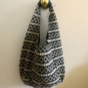 Hobo black & white shoulder bag with snap close